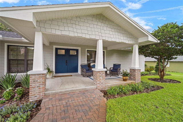 22238 River Rock Dr, Land O Lakes, FL 34639 - entrance to property with covered porch and a lawn