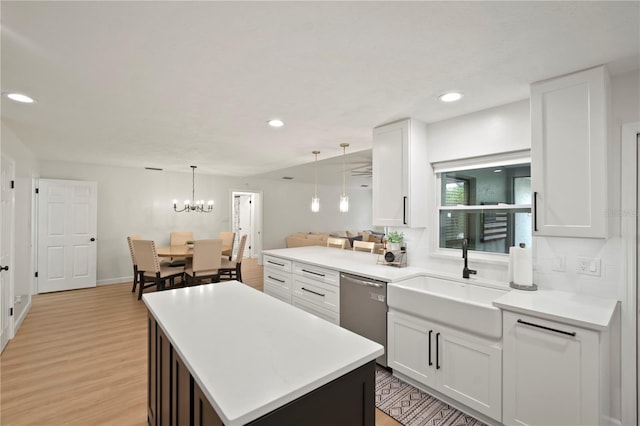 22238 River Rock Dr, Land O Lakes, FL 34639 - kitchen featuring dishwasher, light wood-style flooring, light countertops, white cabinets, and recessed lighting