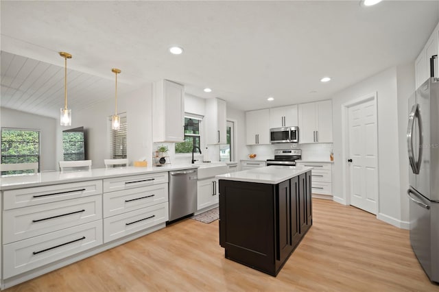 22238 River Rock Dr, Land O Lakes, FL 34639 - kitchen with stainless steel appliances, healthy amount of natural light, white cabinetry, and recessed lighting