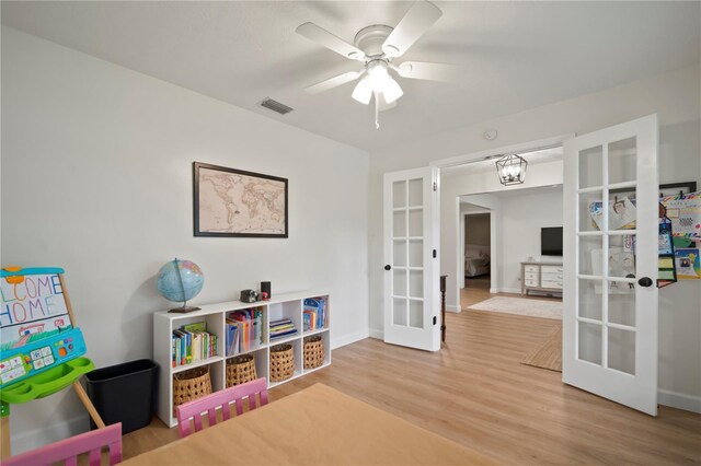 22238 River Rock Dr, Land O Lakes, FL 34639 - playroom featuring french doors, wood finished floors, and a ceiling fan