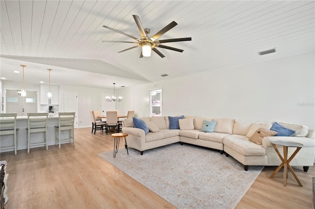 22238 River Rock Dr, Land O Lakes, FL 34639 - living area featuring a ceiling fan, light wood finished floors, lofted ceiling, wood ceiling, and a chandelier