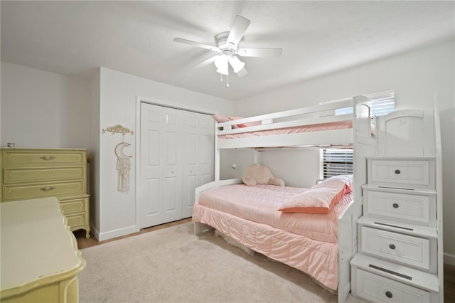 22238 River Rock Dr, Land O Lakes, FL 34639 - bedroom featuring a closet, ceiling fan, and wood finished floors