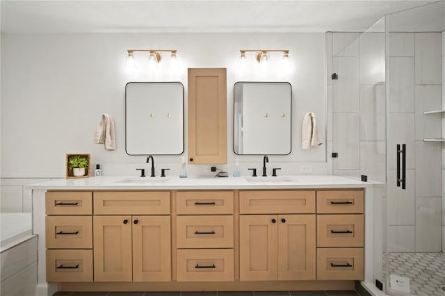 22238 River Rock Dr, Land O Lakes, FL 34639 - bathroom featuring a shower stall and double vanity