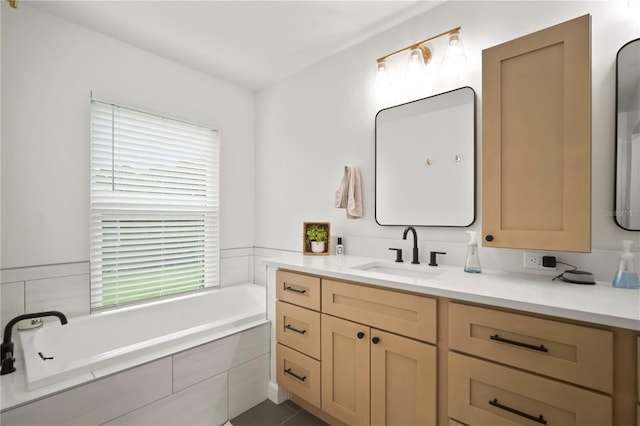 22238 River Rock Dr, Land O Lakes, FL 34639 - full bathroom with vanity, a bath, and tile patterned flooring