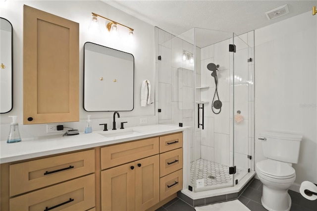 22238 River Rock Dr, Land O Lakes, FL 34639 - full bath featuring vanity, a stall shower, and tile patterned floors