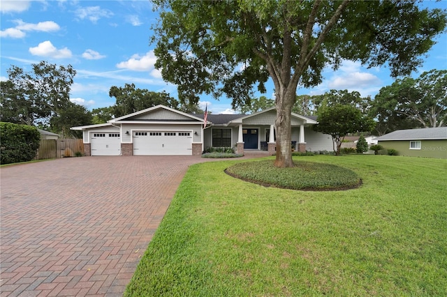 22238 River Rock Dr, Land O Lakes, FL 34639 - view of front of house with a garage, decorative driveway, and brick siding