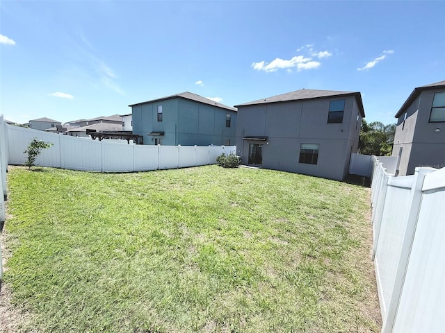 10221 Carloway Hills Dr, Wimauma, FL 33598 - rear view of house with a fenced backyard