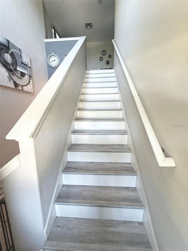 10221 Carloway Hills Dr, Wimauma, FL 33598 - staircase featuring wood finished floors and baseboards