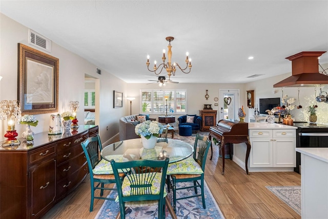 621 77th Ave, St Pete Beach, FL 33706 - dining area with a chandelier, light wood-style flooring, and recessed lighting