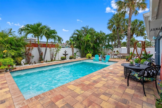 621 77th Ave, St Pete Beach, FL 33706 - view of swimming pool featuring a patio area and a fenced backyard