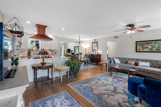 621 77th Ave, St Pete Beach, FL 33706 - living area with light wood-style floors, a chandelier, ceiling fan, and recessed lighting
