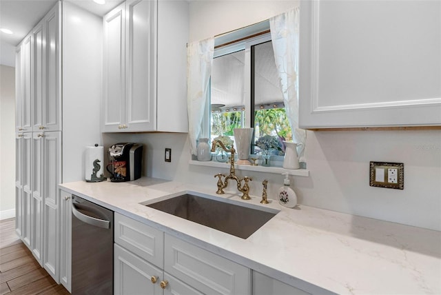 621 77th Ave, St Pete Beach, FL 33706 - kitchen featuring dishwasher, white cabinetry, light stone counters, wood finished floors, and recessed lighting
