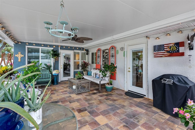 621 77th Ave, St Pete Beach, FL 33706 - view of patio with area for grilling and a ceiling fan