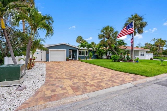 621 77th Ave, St Pete Beach, FL 33706 - single story home featuring decorative driveway and an attached garage