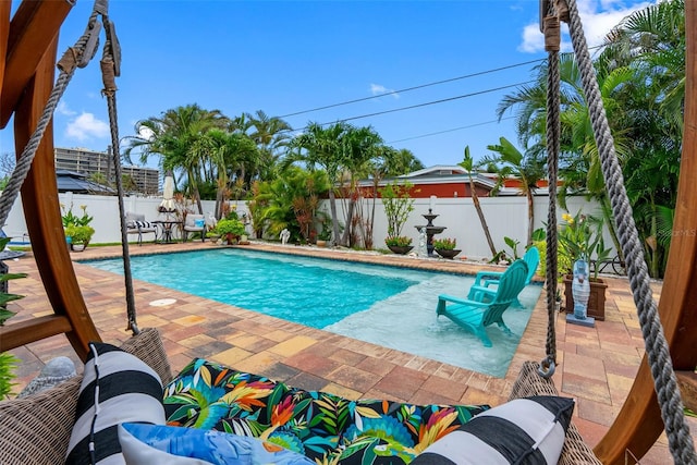621 77th Ave, St Pete Beach, FL 33706 - view of swimming pool featuring a patio area and a fenced backyard