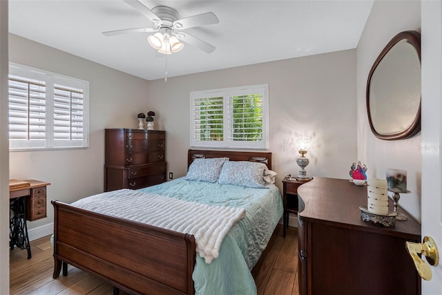 621 77th Ave, St Pete Beach, FL 33706 - bedroom featuring wood finished floors and a ceiling fan