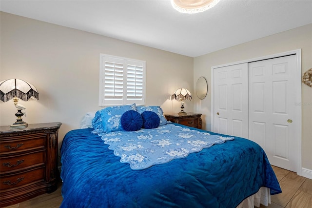 621 77th Ave, St Pete Beach, FL 33706 - bedroom with a closet and wood finished floors