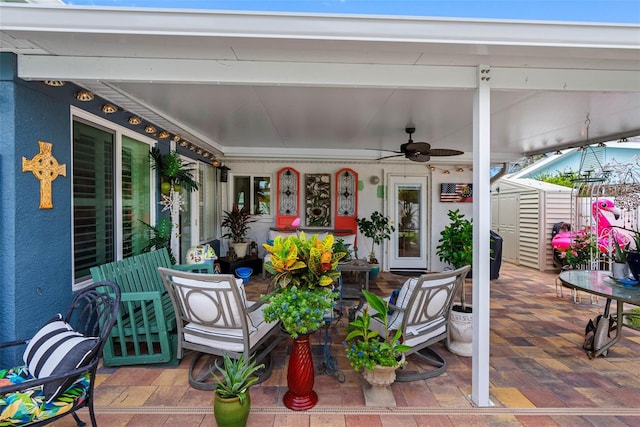 621 77th Ave, St Pete Beach, FL 33706 - view of patio featuring a storage shed and a ceiling fan