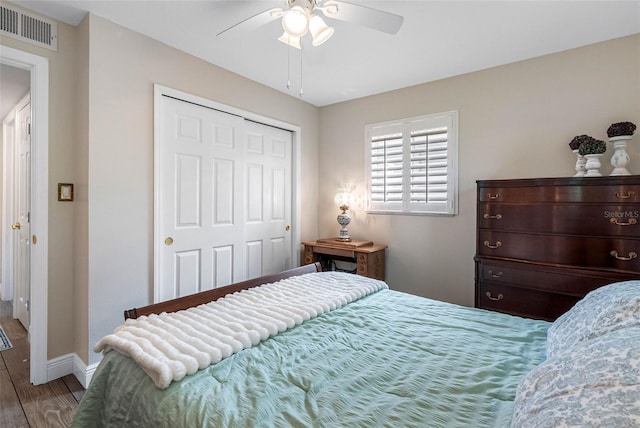 621 77th Ave, St Pete Beach, FL 33706 - bedroom with wood finished floors, a closet, and ceiling fan