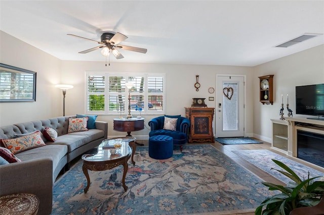 621 77th Ave, St Pete Beach, FL 33706 - living room with wood finished floors and a ceiling fan