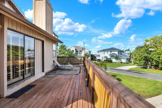 101 Carlyle Dr, Palm Harbor, FL 34683 - wooden deck with a residential view and a lawn