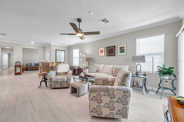 31530 Magna Gulf Loop, San Antonio, FL 33576 - living area featuring healthy amount of natural light, crown molding, ceiling fan, a textured ceiling, and recessed lighting