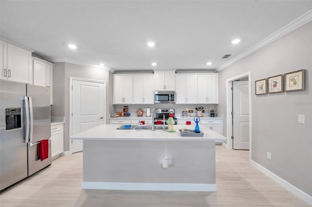 31530 Magna Gulf Loop, San Antonio, FL 33576 - kitchen featuring stainless steel appliances, ornamental molding, white cabinetry, light countertops, and recessed lighting