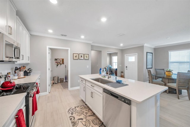31530 Magna Gulf Loop, San Antonio, FL 33576 - kitchen featuring appliances with stainless steel finishes, recessed lighting, white cabinetry, light countertops, and crown molding
