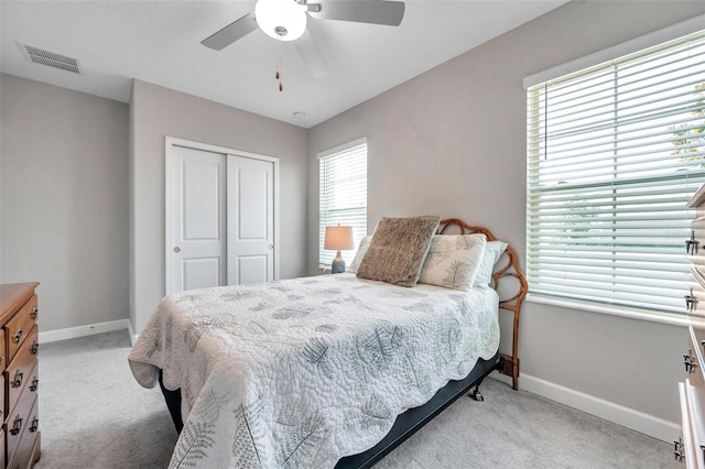 31530 Magna Gulf Loop, San Antonio, FL 33576 - bedroom with carpet, a closet, and a ceiling fan