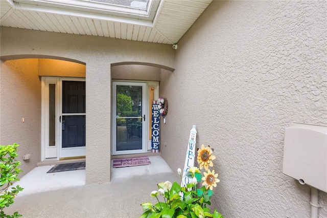 8251 118th Ave Unit 8251, Largo, FL 33773 - view of exterior entry with stucco siding
