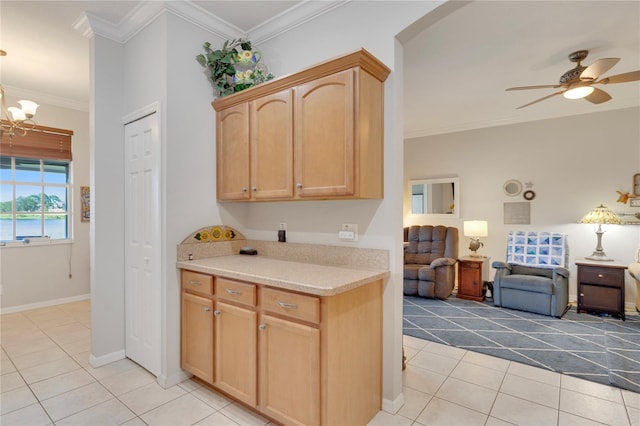 8251 118th Ave Unit 8251, Largo, FL 33773 - kitchen featuring light tile patterned flooring, open floor plan, a ceiling fan, light countertops, and ornamental molding