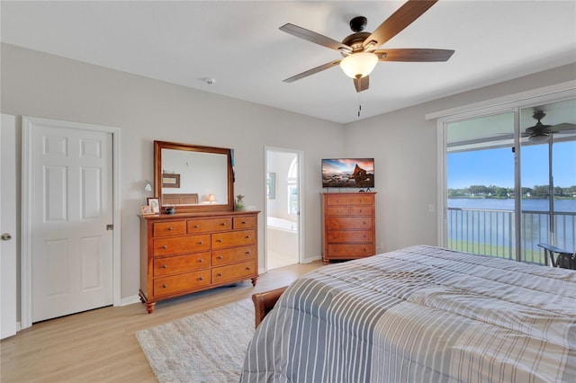 8251 118th Ave Unit 8251, Largo, FL 33773 - bedroom featuring access to exterior, light wood-style floors, a ceiling fan, and connected bathroom