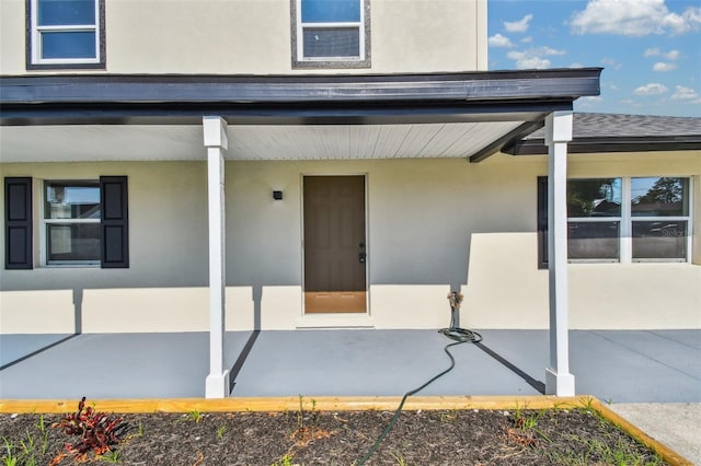 7806 N Matanzas Ave, Tampa, FL 33614 - entrance to property featuring stucco siding and a patio area