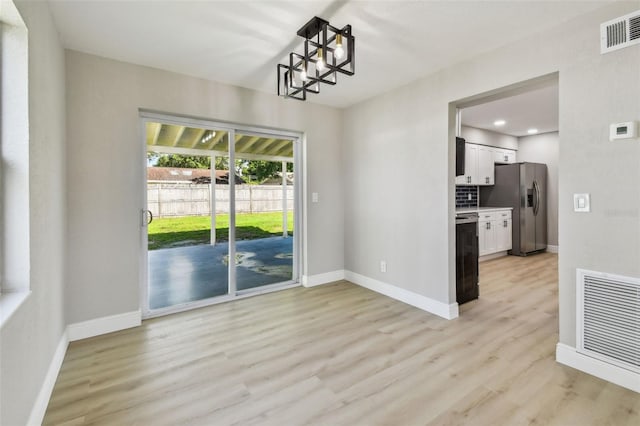 7806 N Matanzas Ave, Tampa, FL 33614 - unfurnished dining area with light wood-style flooring and recessed lighting