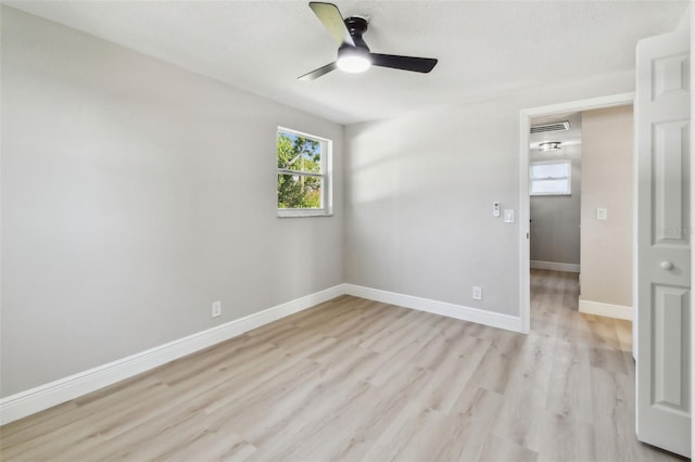 7806 N Matanzas Ave, Tampa, FL 33614 - empty room with light wood-style flooring and a ceiling fan