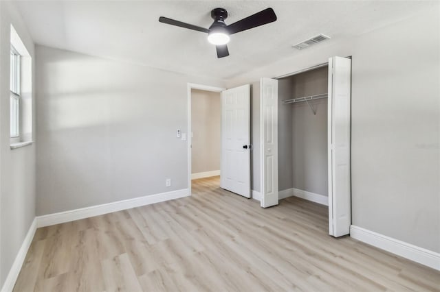 7806 N Matanzas Ave, Tampa, FL 33614 - unfurnished bedroom featuring light wood finished floors, a closet, and a ceiling fan
