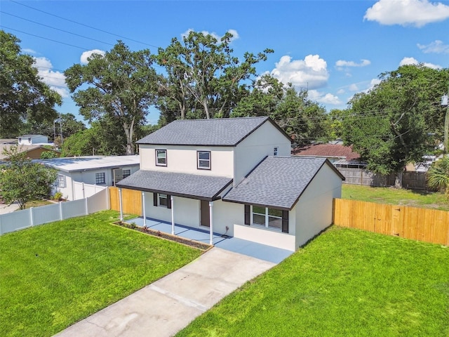 7806 N Matanzas Ave, Tampa, FL 33614 - view of front of home with a shingled roof, stucco siding, covered porch, and a fenced backyard