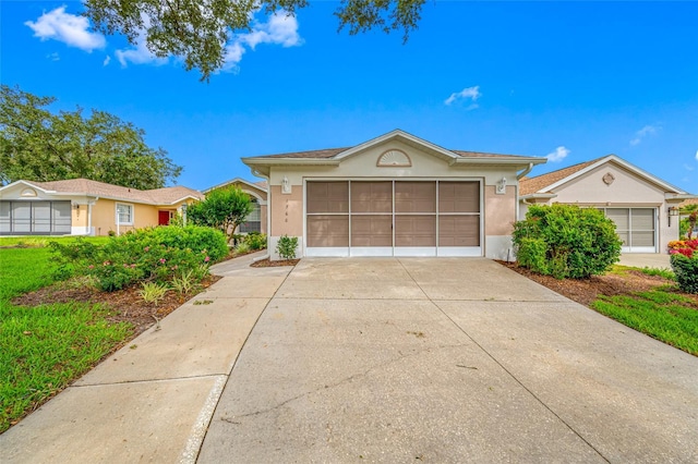 1760 W Shanelle Path, Lecanto, FL 34461 - view of front of house featuring stucco siding, driveway, and a garage
