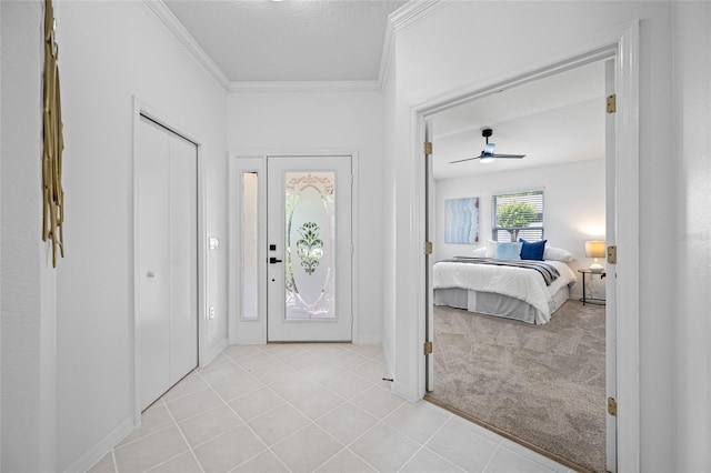 1760 W Shanelle Path, Lecanto, FL 34461 - entryway featuring crown molding, light tile patterned flooring, light carpet, and a ceiling fan