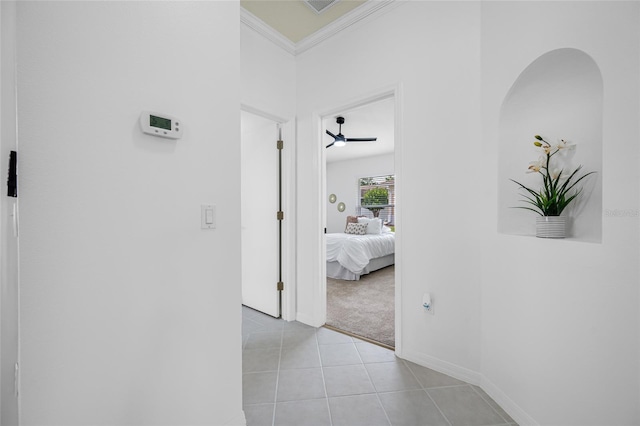 1760 W Shanelle Path, Lecanto, FL 34461 - hallway featuring light colored carpet, light tile patterned flooring, and crown molding
