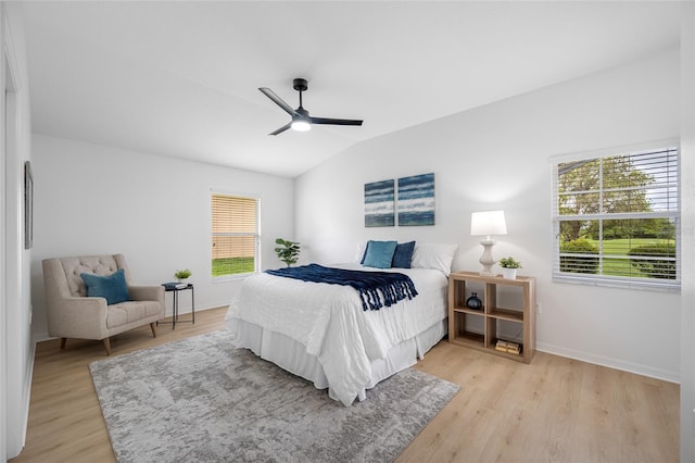 1760 W Shanelle Path, Lecanto, FL 34461 - bedroom featuring multiple windows, light wood-type flooring, lofted ceiling, and a ceiling fan