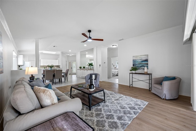 1760 W Shanelle Path, Lecanto, FL 34461 - living area featuring ornamental molding, a ceiling fan, light wood-type flooring, and ornate columns