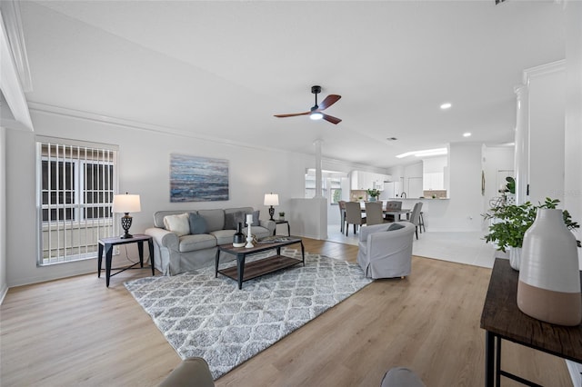 1760 W Shanelle Path, Lecanto, FL 34461 - living room with a ceiling fan, light wood finished floors, lofted ceiling, ornamental molding, and recessed lighting