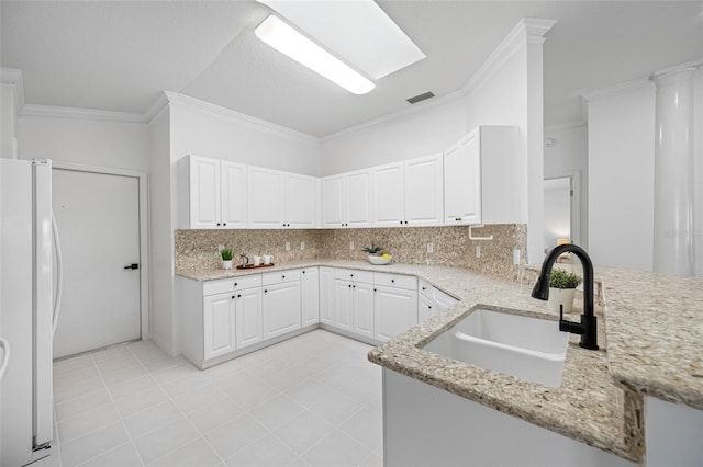 1760 W Shanelle Path, Lecanto, FL 34461 - kitchen with freestanding refrigerator, ornamental molding, decorative backsplash, and light stone counters