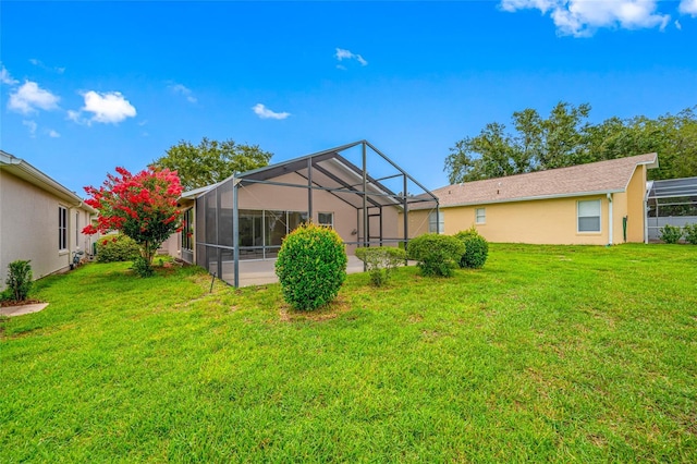 1760 W Shanelle Path, Lecanto, FL 34461 - rear view of house with a yard, a lanai, and stucco siding