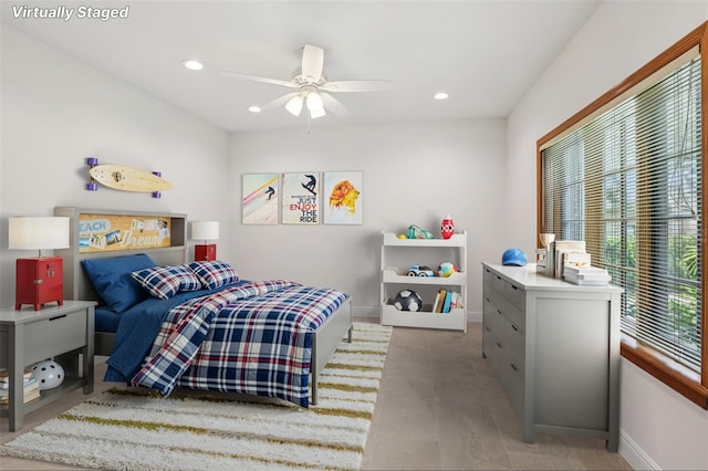 4128 Carrollwood Village Dr, Tampa, FL 33618 - tiled bedroom with recessed lighting and ceiling fan