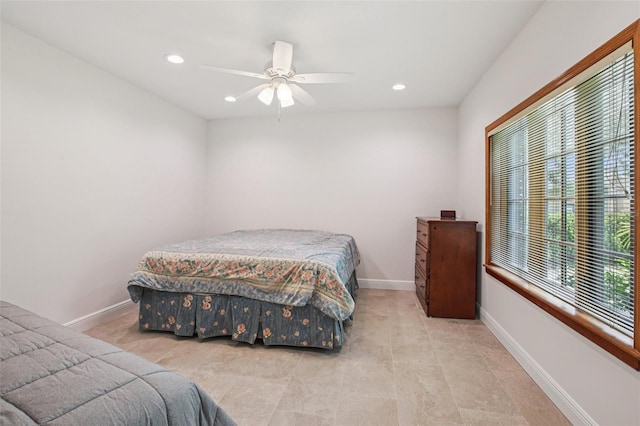 4128 Carrollwood Village Dr, Tampa, FL 33618 - tiled bedroom with recessed lighting and a ceiling fan