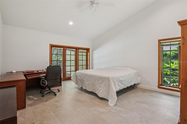4128 Carrollwood Village Dr, Tampa, FL 33618 - bedroom with vaulted ceiling, multiple windows, an office area, french doors, and ceiling fan