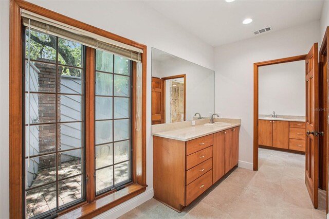 4128 Carrollwood Village Dr, Tampa, FL 33618 - bathroom with vanity, recessed lighting, and tile patterned floors