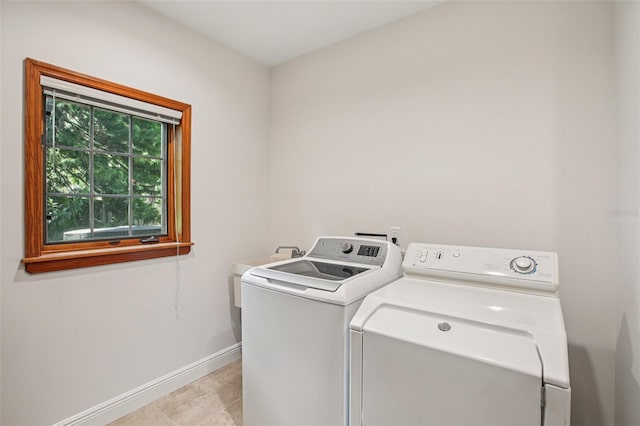 4128 Carrollwood Village Dr, Tampa, FL 33618 - laundry area with independent washer and dryer and baseboards